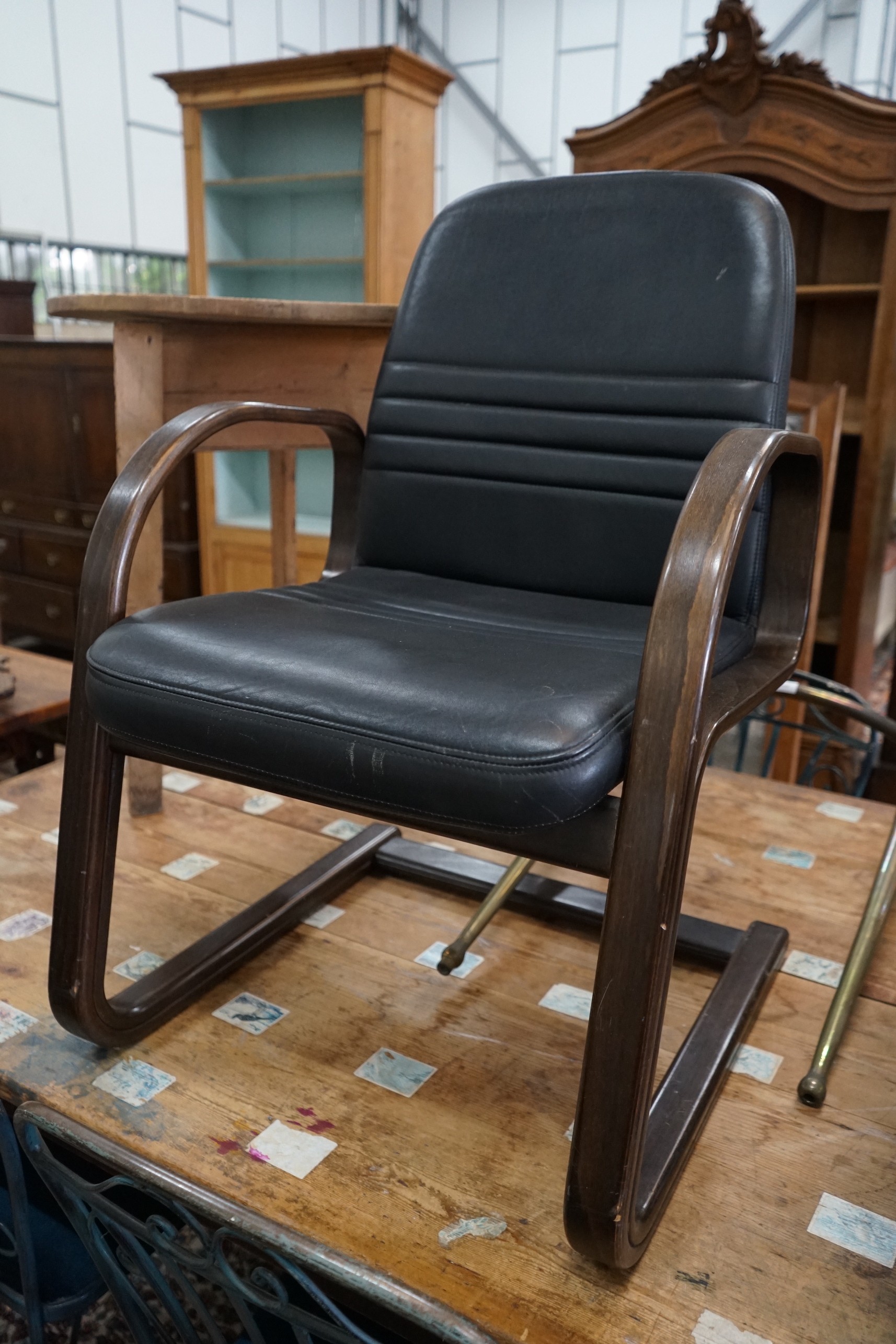 A pair of Sedus cantilever chairs, wood and black leather, width 60cm, depth 54cm, height 90cm